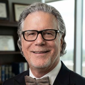 Tom Levine founder Native Angelino Real Estate in Los Angeles in a black tuxedo with bow tie.